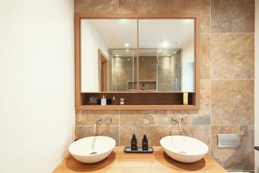 Bespoke oak vanity unit with twin basins, made to fit the room