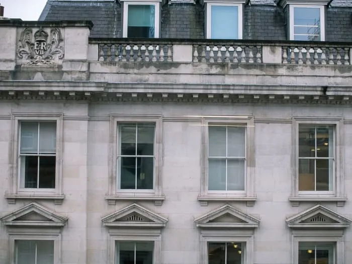 Timber sash windows in a period stone facade
