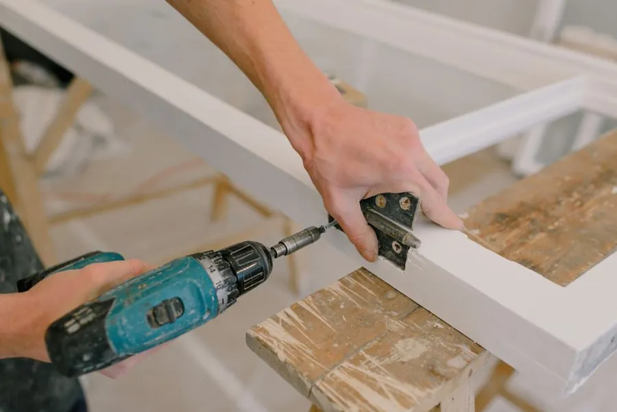 Adjusting a hinge on fitted joinery, a repair better done early than late