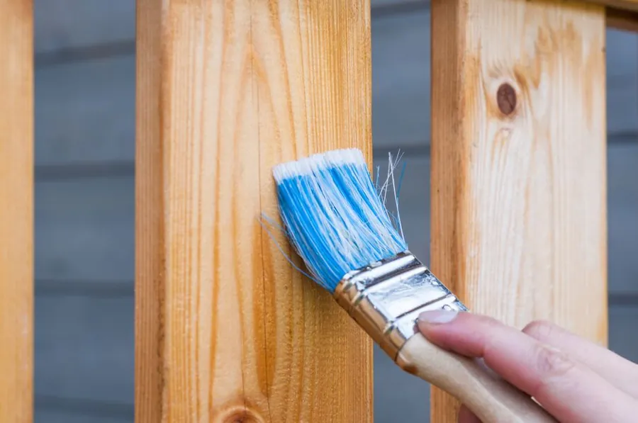 Applying an exterior finish to timber with a brush, the recoating routine external joinery needs in Torbay
