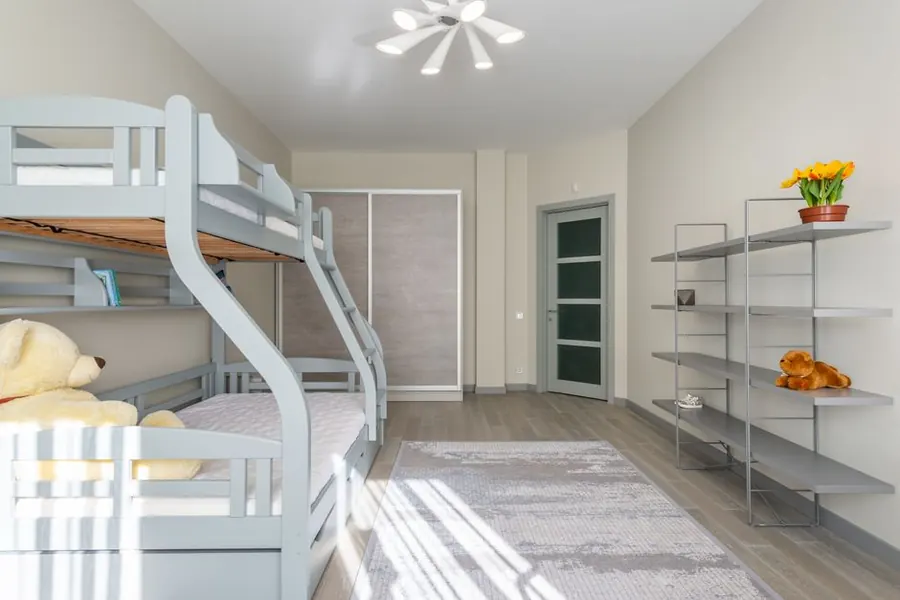 Built-in bunk beds in a small bedroom, the sort of fitted joinery that raises a holiday let's bed count