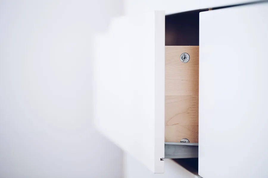 Open drawer showing a timber drawer box and runner, the construction used under a bay window seat in Torquay