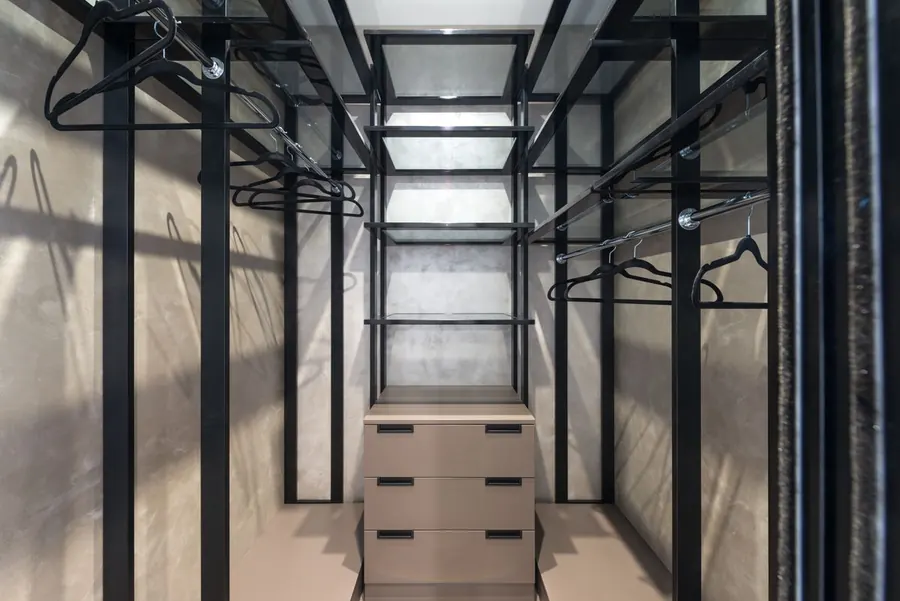 Fitted wardrobe interior with drawers and hanging space, where a large share of the cost sits