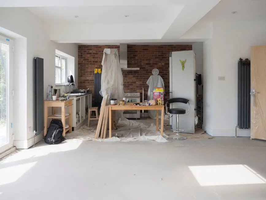 Fitting week on site, with joinery being installed in a kitchen under refurbishment
