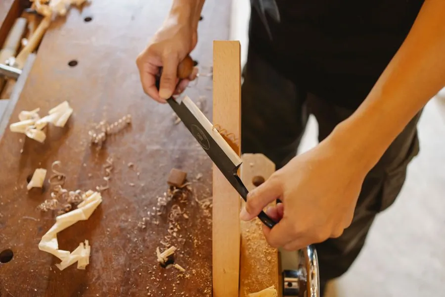 Cutting a joint by hand at the bench, the making stage of a bespoke joinery commission