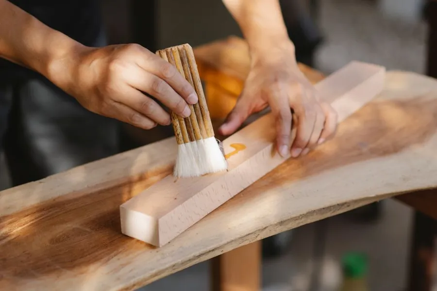 Applying an oil finish to timber joinery as part of routine maintenance