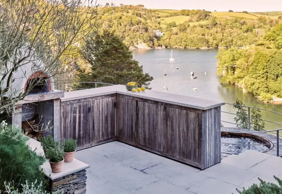 Weathered external timber joinery on a terrace above a South Devon estuary