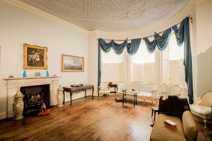 Period English drawing room with marble fireplace, deep alcoves and ornate ceiling, the room type a Torquay alcove media unit is fitted into