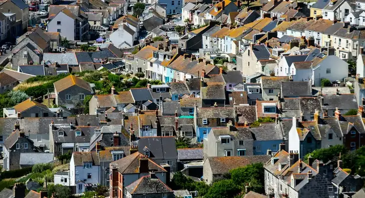 Rows of terraced houses packed tightly across a steep hillside