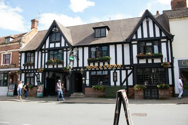 A black and white mock-Tudor building on a town street