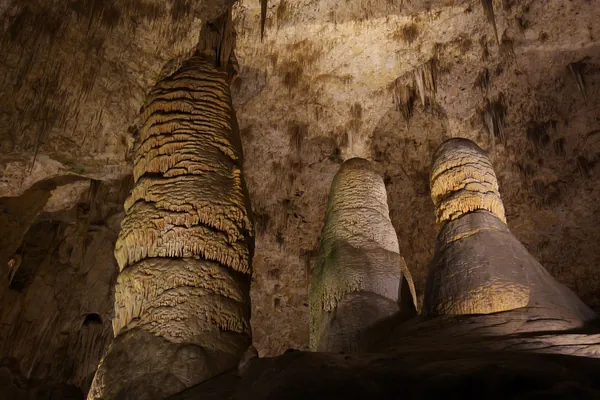 Stalagmites and flowstone formations inside a limestone cave
